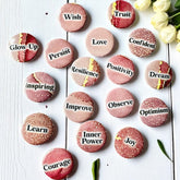 Set of 1-inch affirmation buttons with positive affirmations on a soft, pale pink background, protected by a clear plastic coating, ideal for charm casting, journaling, oracle card spreads, and daily inspiration.